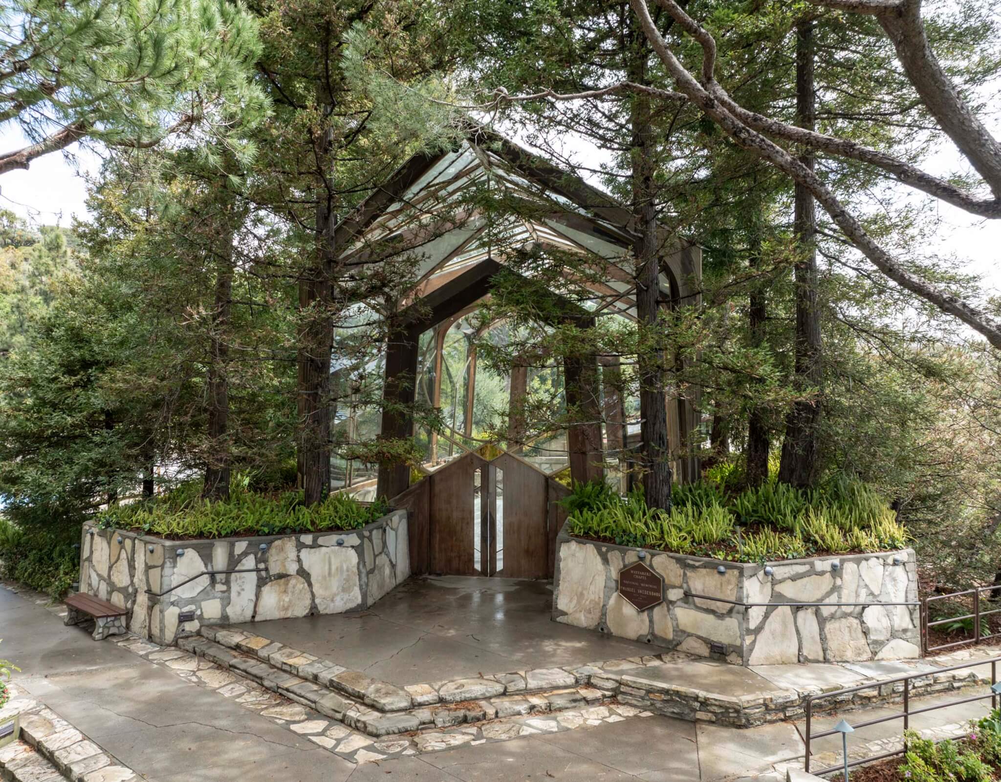 forested entry to chapel